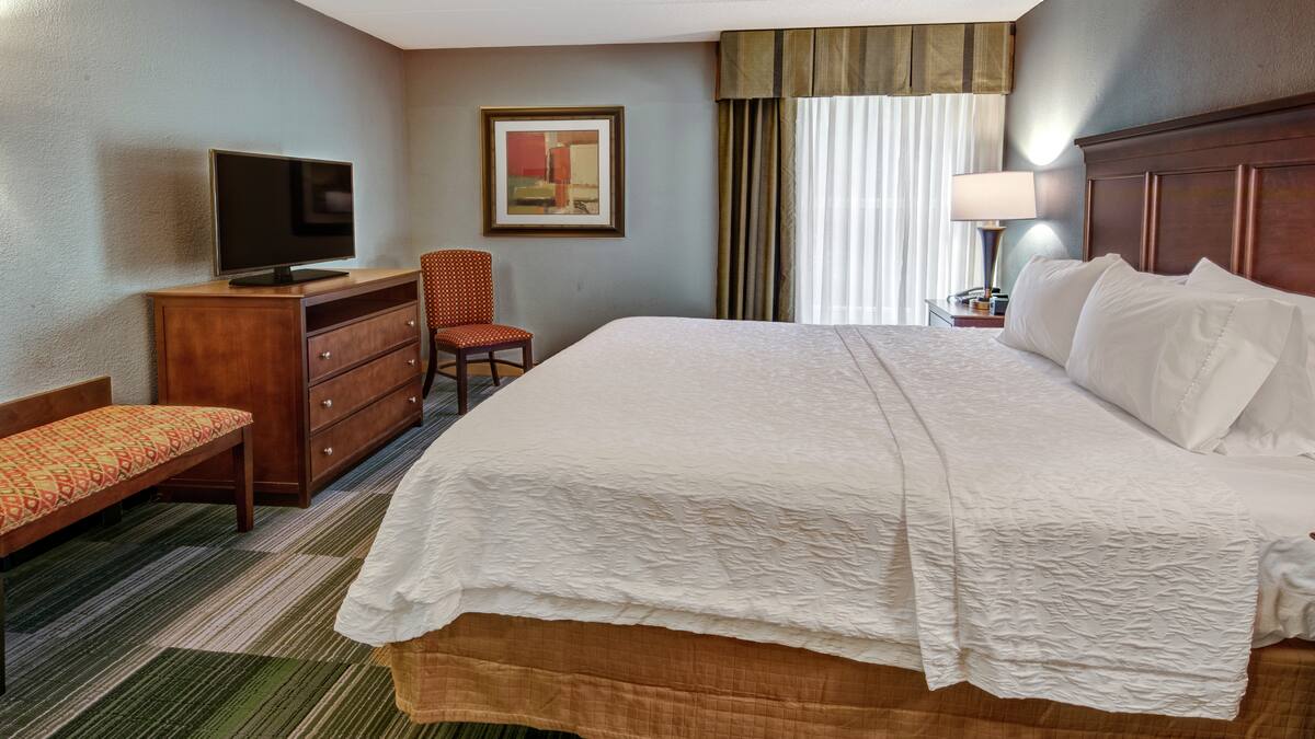 King Whirlpool Suite with king bed and in-room whirlpool tub